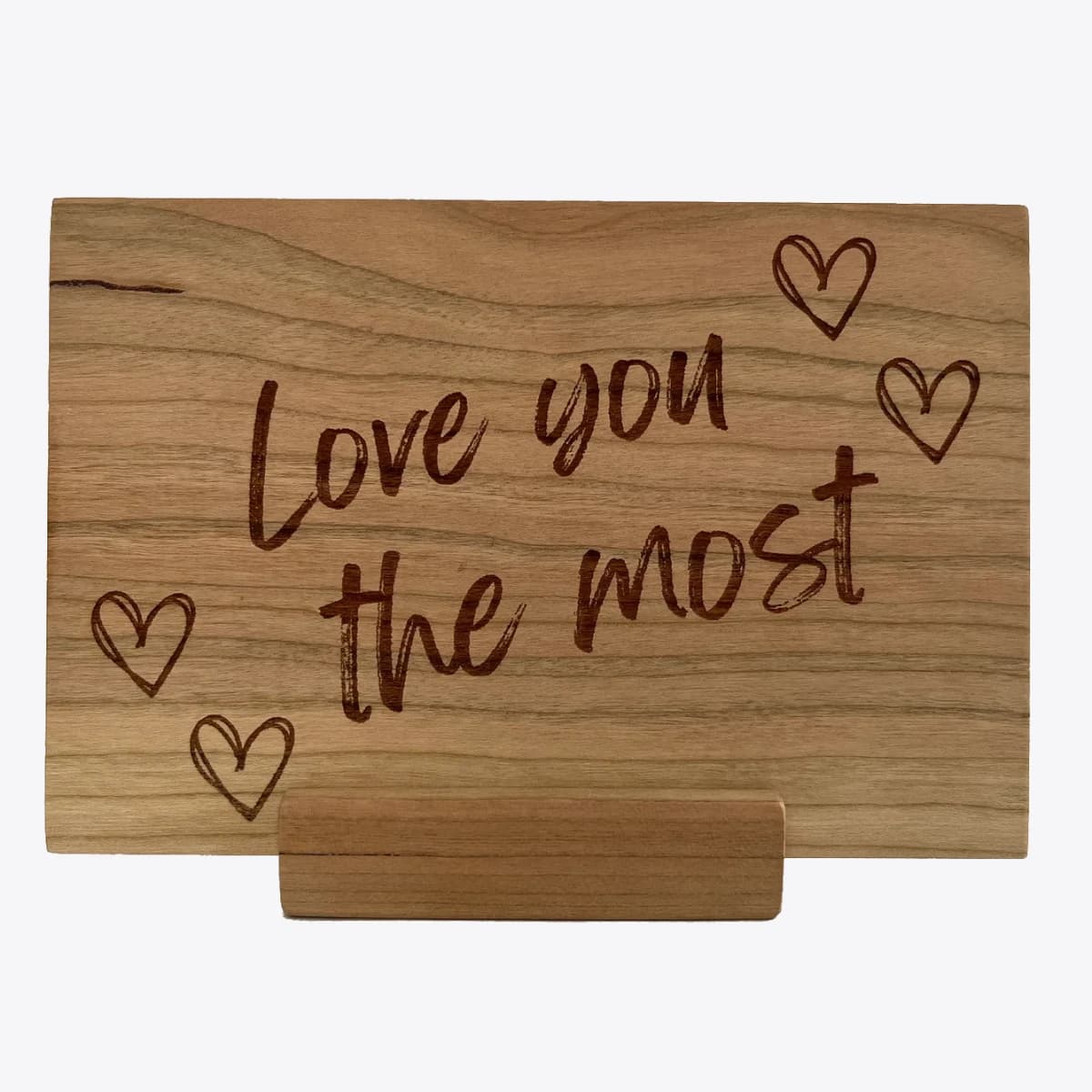 Wooden card engraved with the message " Love you the most".