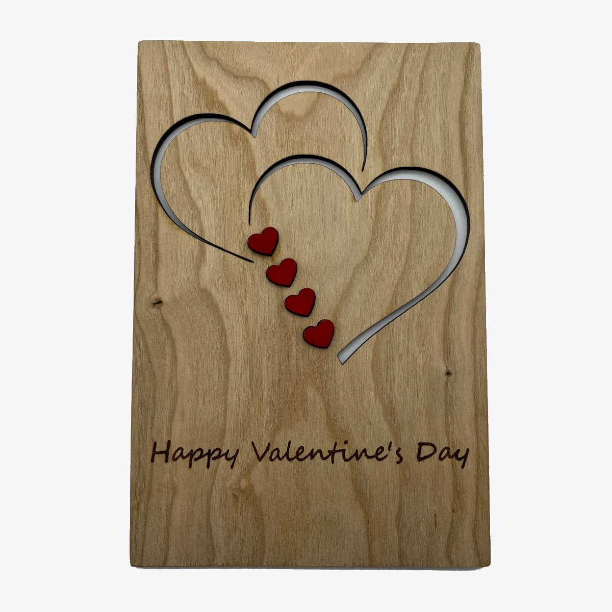 Wooden card with two engraved heart's and the message "Happy Valentine's Day" engraved"