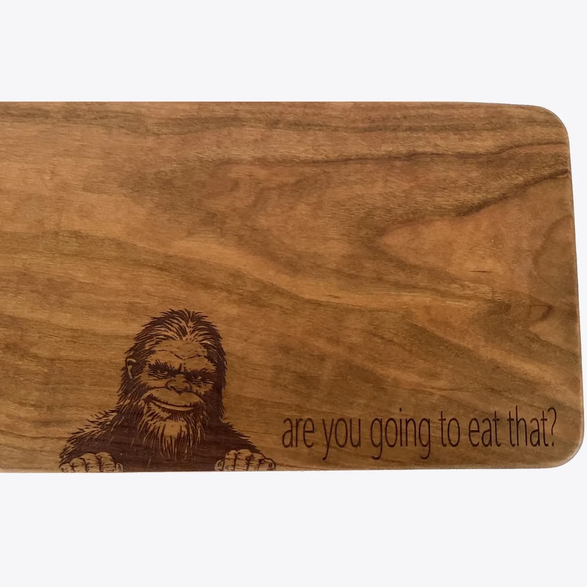 Cutting board with bigfoot engraved on it along with the message "are you going to eat that?"